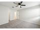 Bright bedroom with ceiling fan and access to hallway bathroom at 19912 N Toledo Ave, Maricopa, AZ 85138