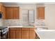 Well-equipped kitchen featuring wood cabinets and a stylish backsplash at 19912 N Toledo Ave, Maricopa, AZ 85138
