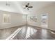 Spacious living room with hardwood floors and sliding door access to backyard at 19912 N Toledo Ave, Maricopa, AZ 85138