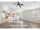 Spacious living room with hardwood floors and kitchen views at 19912 N Toledo Ave, Maricopa, AZ 85138