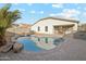 Relaxing kidney-shaped pool in a private backyard setting at 19912 N Toledo Ave, Maricopa, AZ 85138
