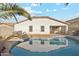 Inviting kidney-shaped pool with ample surrounding patio space at 19912 N Toledo Ave, Maricopa, AZ 85138