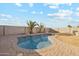 Sparkling blue pool with brick patio and desert landscaping at 19912 N Toledo Ave, Maricopa, AZ 85138