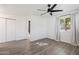 Bright bedroom with wood-look floors and ceiling fan at 2136 W Meadow Dr, Phoenix, AZ 85023