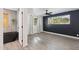 Bright bedroom with dark accent wall and a view of the bathroom at 2136 W Meadow Dr, Phoenix, AZ 85023