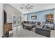 Cozy living room featuring a comfortable sectional sofa and a coffee table at 225 S 123Rd Dr, Avondale, AZ 85323