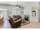 Bright living room featuring a cozy seating area and large windows at 2250 S Bernard St, Mesa, AZ 85209