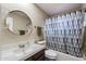 Clean bathroom with shower/tub combo, vanity, and tile flooring at 255 N Hunt E Dr, Mesa, AZ 85203
