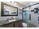 Updated bathroom with gray vanity, large mirror, and glass shower at 255 N Hunt E Dr, Mesa, AZ 85203