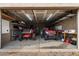 Spacious garage with various tools and vehicles at 255 N Hunt E Dr, Mesa, AZ 85203