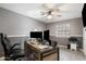 Home office with wood desk, two monitors, and comfortable chair at 255 N Hunt E Dr, Mesa, AZ 85203