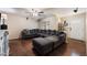 Spacious living room featuring a large sectional sofa and wood flooring at 255 N Hunt E Dr, Mesa, AZ 85203