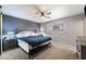 King-size bedroom with dark gray walls, and ceiling fan at 255 N Hunt E Dr, Mesa, AZ 85203