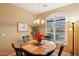 Bright dining area with wooden table and four chairs at 2725 E Mine Creek Rd # 1121, Phoenix, AZ 85024