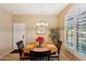 Bright dining area with wooden table and four chairs at 2725 E Mine Creek Rd # 1121, Phoenix, AZ 85024