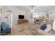 Relaxing living room with sectional sofa, large TV, and wood accent wall at 2736 E Terrace Ave, Gilbert, AZ 85234