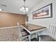 Bright dining area with wood table and chairs at 2745 W Michelle Dr, Phoenix, AZ 85053