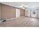 Bright living room with light wood floors and ceiling fan at 2745 W Michelle Dr, Phoenix, AZ 85053