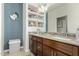 Double vanity bathroom with a built-in shelving unit at 2821 S Skyline Dr # 165, Mesa, AZ 85212