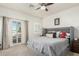 Main bedroom with sliding doors to balcony and ceiling fan at 2821 S Skyline Dr # 165, Mesa, AZ 85212