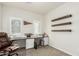 Home office with desk, floating shelves, and window at 2821 S Skyline Dr # 165, Mesa, AZ 85212