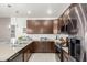 Modern kitchen with dark wood cabinets and island at 2821 S Skyline Dr # 165, Mesa, AZ 85212