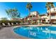 Inviting community pool with lounge chairs and covered seating at 2821 S Skyline Dr # 165, Mesa, AZ 85212