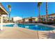 Community pool with surrounding lounge chairs at 2821 S Skyline Dr # 165, Mesa, AZ 85212