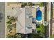 An aerial view showcasing a single-Gathering home with a pool and surrounding landscape at 2856 E Cochise Rd, Phoenix, AZ 85028
