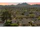Aerial view of a house with a pool, showcasing mountain views and surrounding neighborhood at 2856 E Cochise Rd, Phoenix, AZ 85028