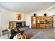 Living room with a built-in shelving unit, fireplace and a modern aesthetic at 2856 E Cochise Rd, Phoenix, AZ 85028