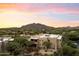 Aerial view of a two-story home with mountain backdrop at 36601 N Mule Train Rd # 1D, Carefree, AZ 85377