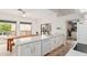 Kitchen with white cabinets, quartz countertops, and a farmhouse style table at 3960 E Graythorn St, Phoenix, AZ 85044