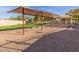 Playground with swings under shade structure at 3960 E Graythorn St, Phoenix, AZ 85044