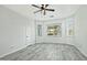 Bright bedroom featuring wood-look floors and a ceiling fan at 4648 S Emery --, Mesa, AZ 85212