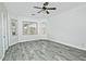 Bright bedroom with wood-look flooring and large window at 4648 S Emery --, Mesa, AZ 85212