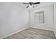 Simple bedroom with wood-look floors and a ceiling fan at 4648 S Emery --, Mesa, AZ 85212