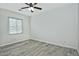 Well-lit bedroom with wood-look floors and window blinds at 4648 S Emery --, Mesa, AZ 85212