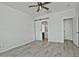Bedroom with barn door entry to bathroom and ceiling fan at 4648 S Emery --, Mesa, AZ 85212