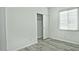 Bedroom with wood-look floors, a closet, and window blinds at 4648 S Emery --, Mesa, AZ 85212