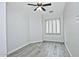 Bedroom with wood-look floors and window shutters at 4648 S Emery --, Mesa, AZ 85212