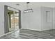 Bright dining room with sliding door to backyard and wood-look floors at 4648 S Emery --, Mesa, AZ 85212