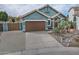 Single-story home with a brown garage door and desert landscaping at 4648 S Emery --, Mesa, AZ 85212