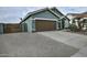 House exterior with brown garage door and gravel driveway at 4648 S Emery --, Mesa, AZ 85212