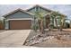 House exterior, two-car garage, and desert landscaping at 4648 S Emery --, Mesa, AZ 85212