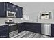 Kitchen with stainless steel appliances and dark blue cabinets at 4648 S Emery --, Mesa, AZ 85212