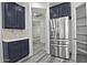 Modern kitchen features stainless steel appliances and dark blue cabinets at 4648 S Emery --, Mesa, AZ 85212