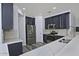 Updated kitchen boasts stainless steel appliances and white quartz countertops at 4648 S Emery --, Mesa, AZ 85212