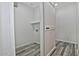 Laundry room with barn door and wood-look floors at 4648 S Emery --, Mesa, AZ 85212
