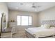 Spacious bedroom with plush bed, dresser, and large window at 5116 N 185Th Ave, Litchfield Park, AZ 85340